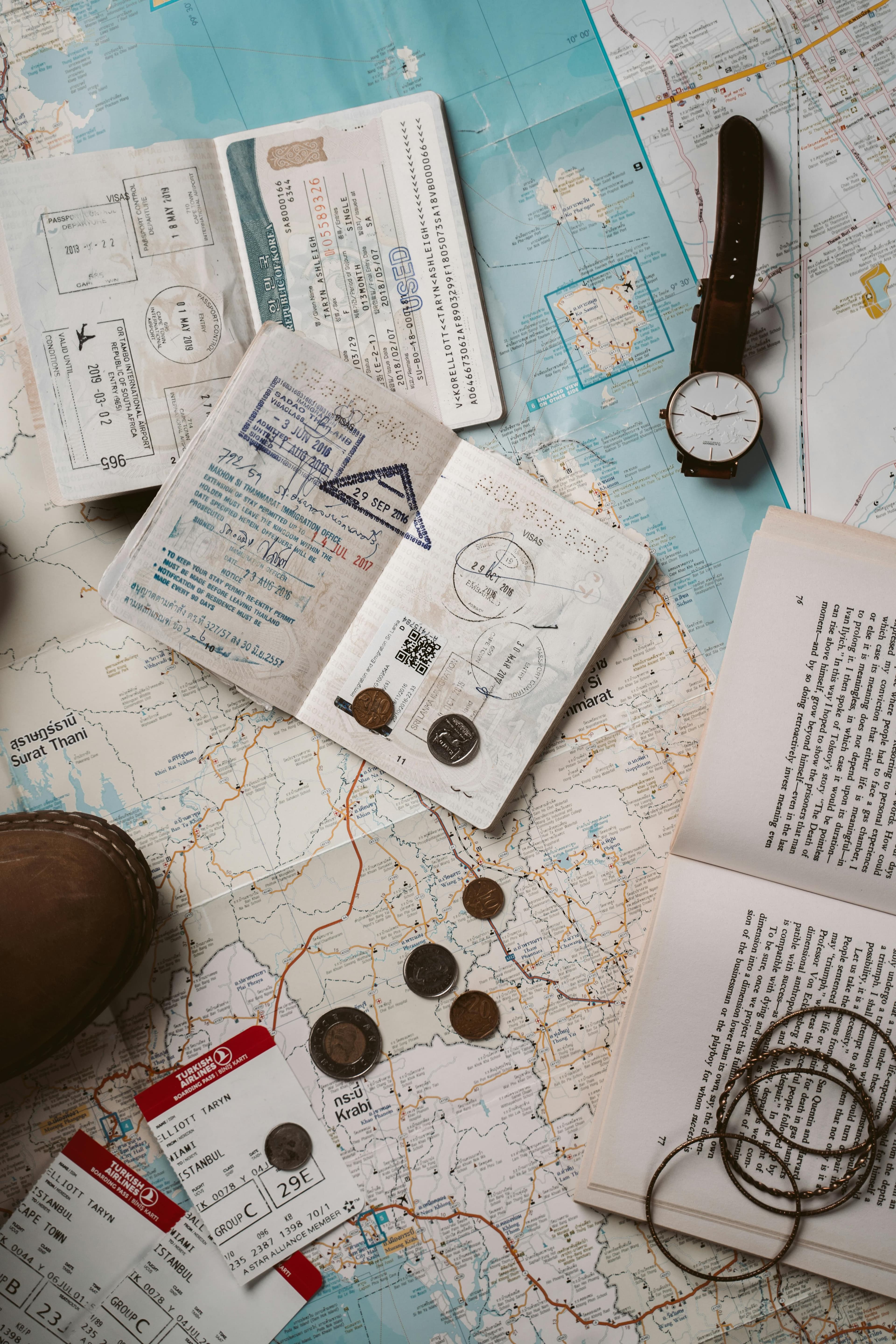 Passports and travel documents on a map